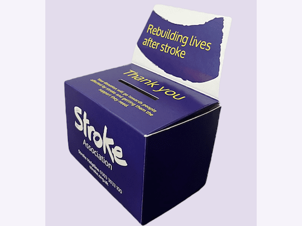 Cardboard collection box. Text reads "Rebuilding lives after stroke"