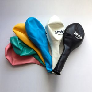 Colourful balloons that say "Stroke Association" on them