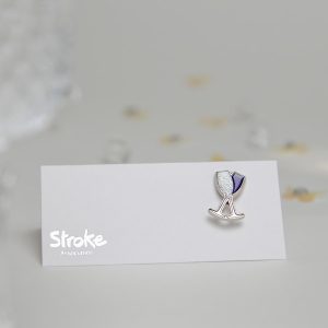 Silver and purple champagne flute pin