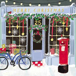 christmas scene with bike and postbox outside shop